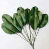 Bunch of realistic faux green magnolia leaves with wired stems for DIY wreath decor