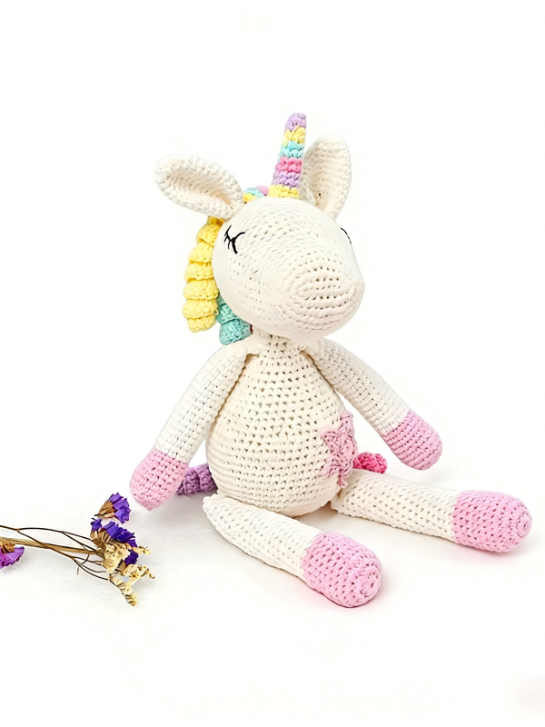 Handmade cotton crochet unicorn amigurumi plush toy with rainbow horn and colorful mane, baby safe stuffed animal for nursery gift