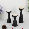 matte-black-cone-candle-holders-lit-pillar-candles-scene Three matte black cone candle holders with lit pillar candles, table decor with lavender and pinecone