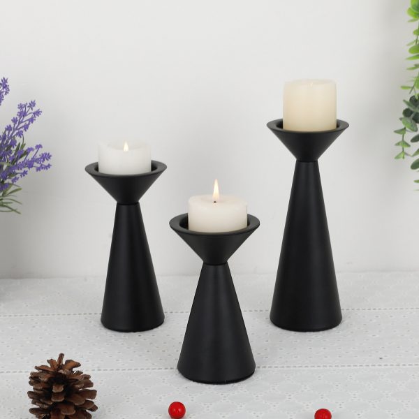 matte-black-cone-candle-holders-lit-pillar-candles-scene Three matte black cone candle holders with lit pillar candles, table decor with lavender and pinecone