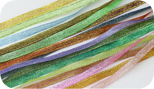 Flat lay of multi-color metallic glitter sheer organza ribbon, shiny glitter ribbon assortment for DIY projects