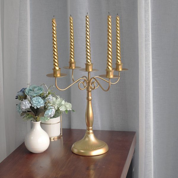 Gold 5 head candelabra with lit twisted taper candles dining table home decor