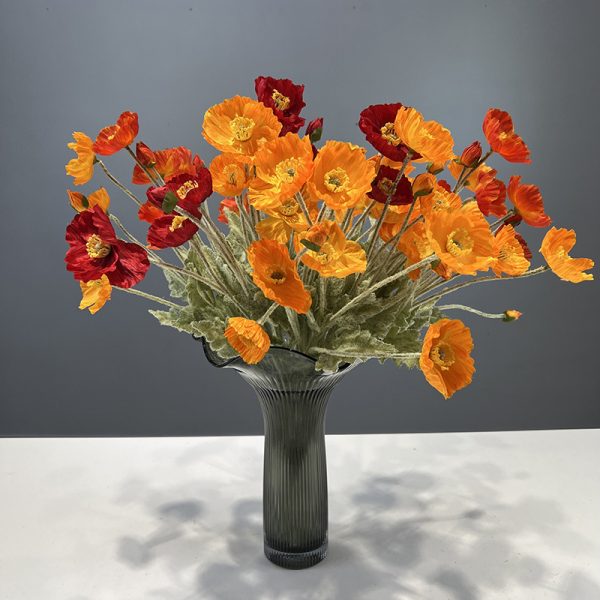 Mixed color flocked iceland poppy artificial flowers arranged in glass vase, home floral display