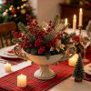 Vintage-white-pedestal-urn-vase-with-double-handles-styled-as-a-Christmas-centerpiece-with-pine-and-red-berries