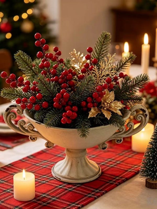 Vintage-white-pedestal-urn-vase-with-double-handles-styled-as-a-Christmas-centerpiece-with-pine-and-red-berries